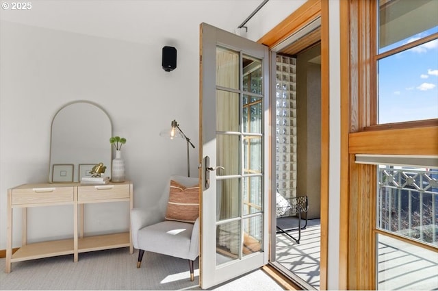 doorway featuring french doors and carpet flooring