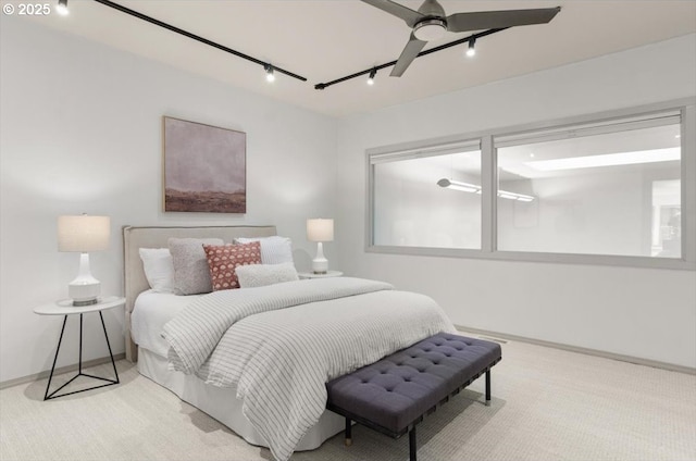 bedroom featuring light carpet and ceiling fan