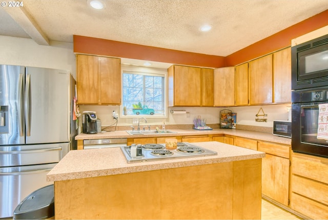 kitchen with black appliances, a kitchen island, sink, and a textured ceiling