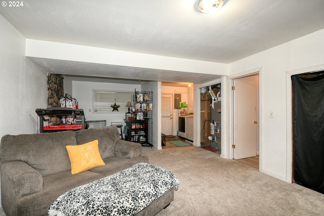 carpeted living room featuring washer / dryer