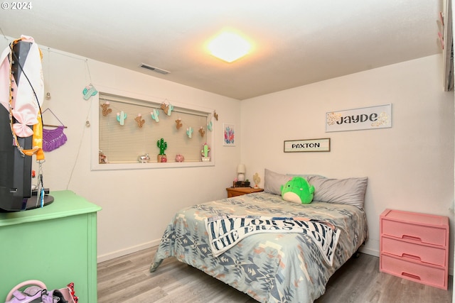 bedroom featuring wood-type flooring