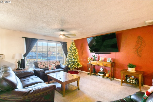 carpeted living room featuring a textured ceiling and ceiling fan