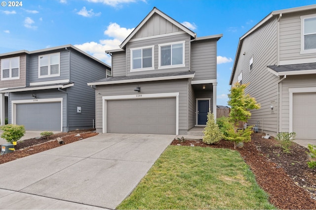 front of property featuring a garage and a front lawn