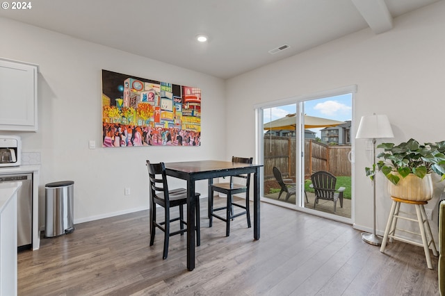 dining space featuring wood-type flooring