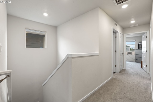 hallway featuring light carpet