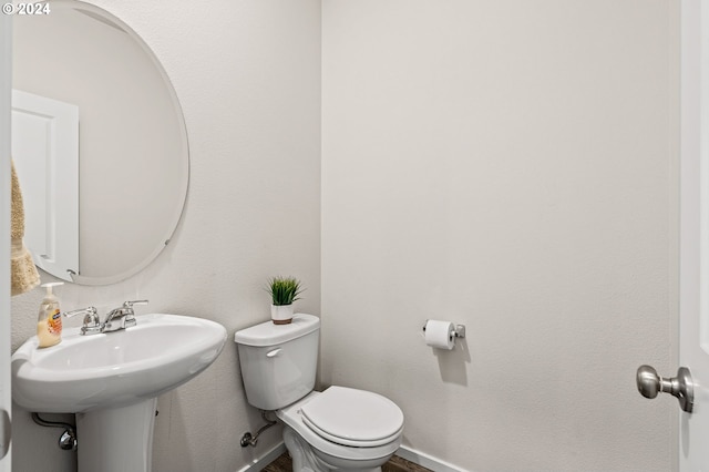 bathroom featuring toilet