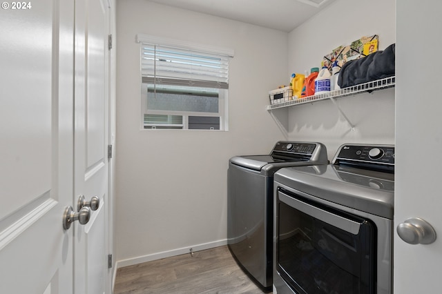 washroom featuring separate washer and dryer and light wood-type flooring