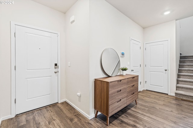 foyer entrance with hardwood / wood-style floors