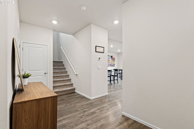 stairs featuring wood-type flooring