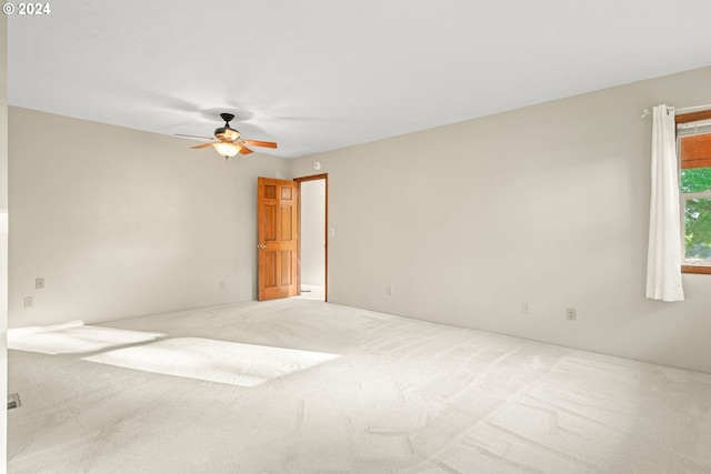 carpeted empty room with ceiling fan