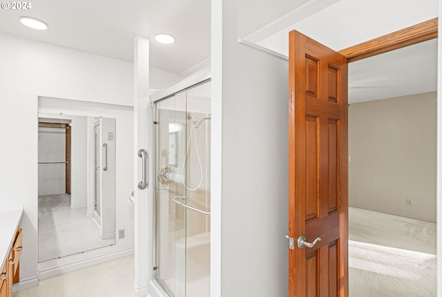 bathroom with vanity and walk in shower