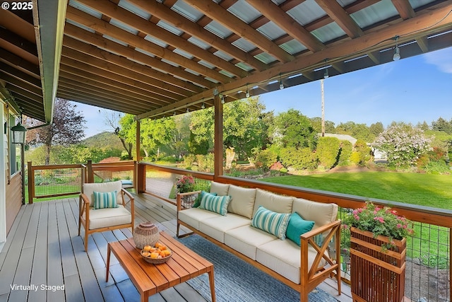 wooden deck featuring an outdoor living space and a yard