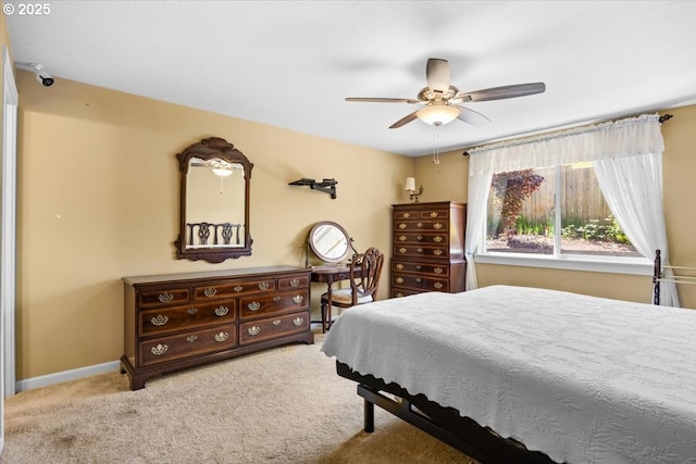 bedroom featuring carpet floors, a ceiling fan, and baseboards