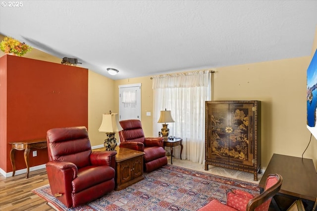 living room with baseboards and wood finished floors