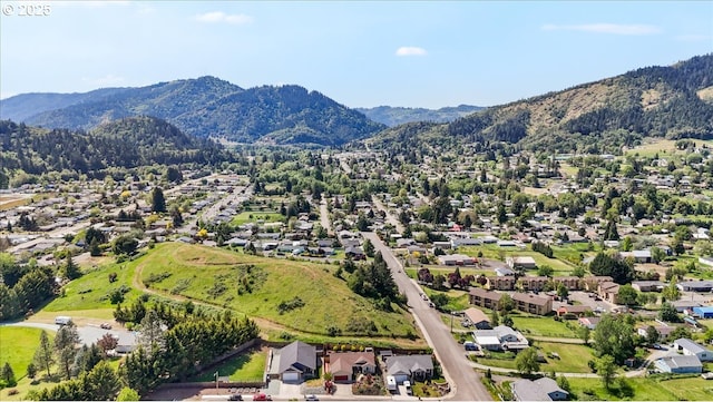 drone / aerial view featuring a mountain view and a residential view
