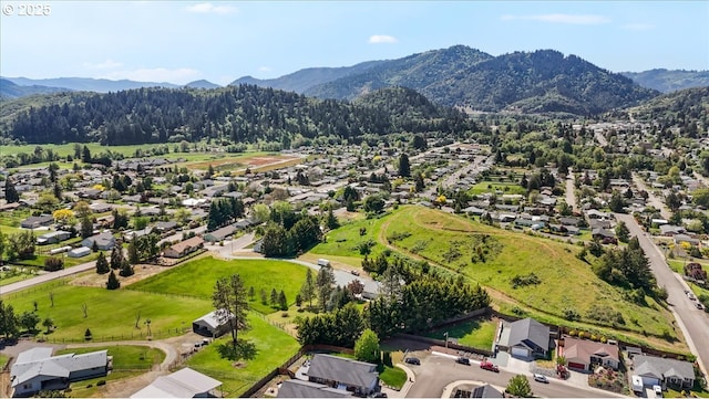 drone / aerial view with a residential view and a mountain view