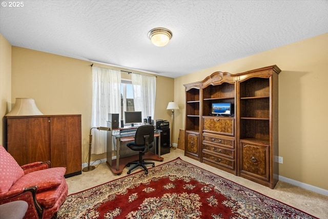 office with baseboards, carpet flooring, and a textured ceiling