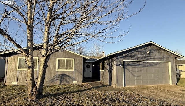 ranch-style home featuring a garage