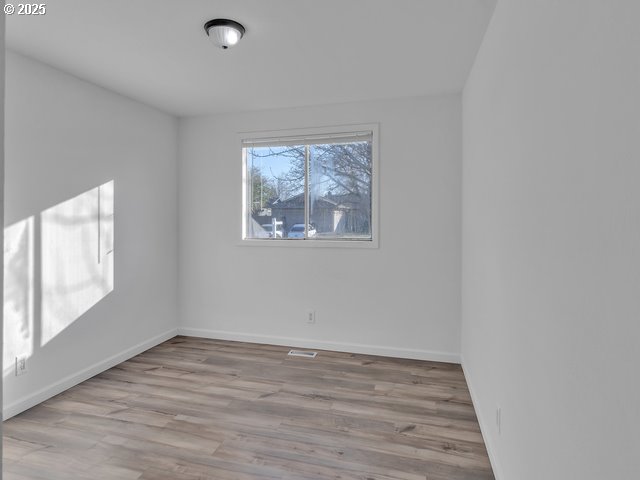 empty room featuring light hardwood / wood-style floors