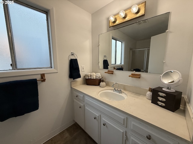 bathroom with vanity and an enclosed shower