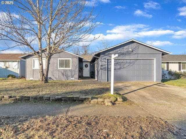 ranch-style home featuring a garage