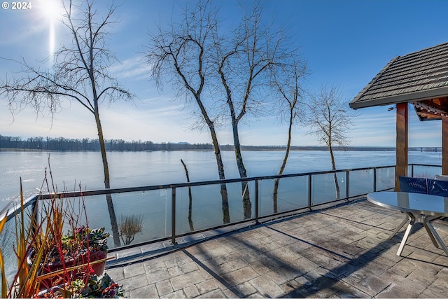 view of patio featuring a water view