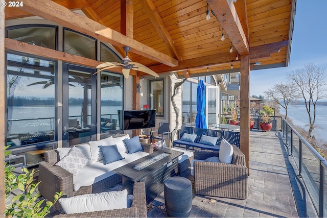 view of patio with an outdoor living space and ceiling fan