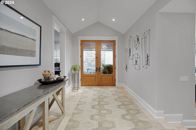 entryway featuring french doors, plenty of natural light, and vaulted ceiling