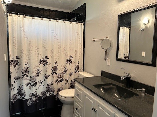 bathroom with vanity, a shower with curtain, toilet, and tile patterned flooring