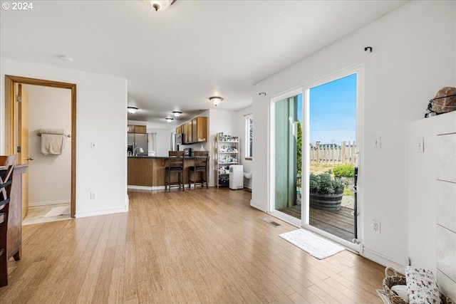 living room with light hardwood / wood-style floors