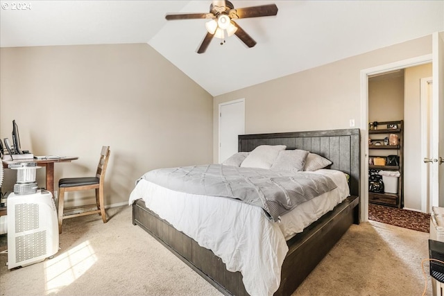 carpeted bedroom featuring vaulted ceiling and ceiling fan