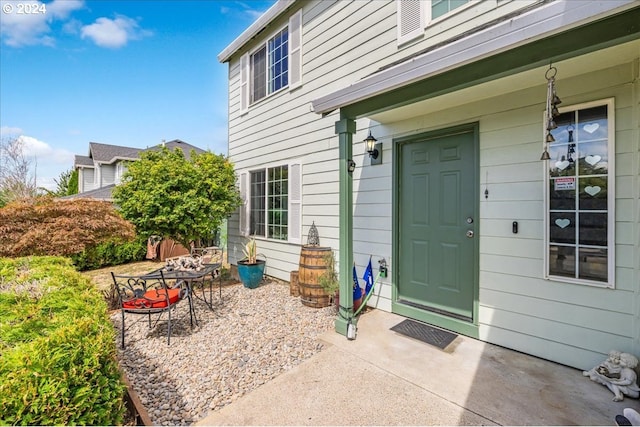 doorway to property with a patio