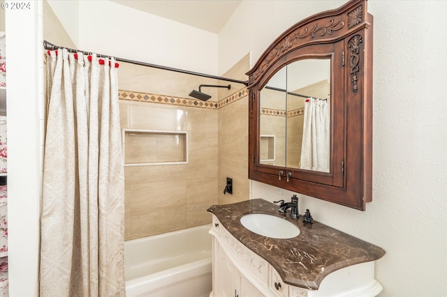 bathroom featuring shower / tub combo and vanity