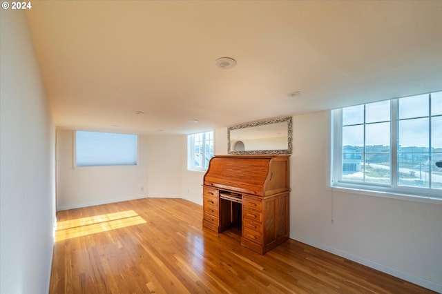 unfurnished living room featuring light hardwood / wood-style flooring