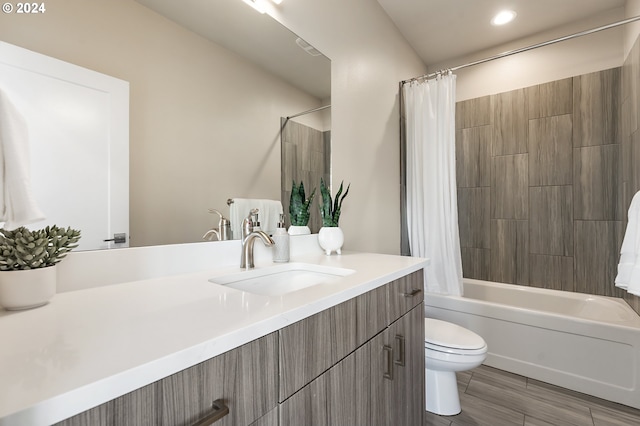 full bathroom featuring vanity, shower / tub combo, and toilet