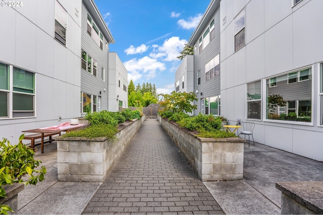 view of home's community with a patio area