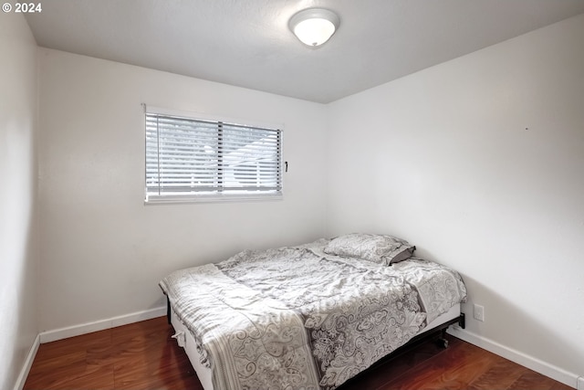 bedroom featuring dark hardwood / wood-style floors