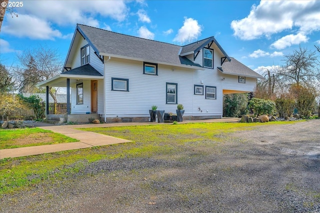 view of front of house featuring a porch and a shingled roof