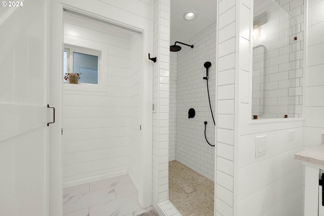 bathroom with tiled shower