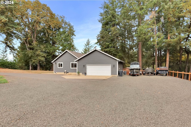 ranch-style home featuring a garage