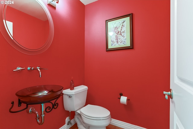 bathroom with sink and toilet