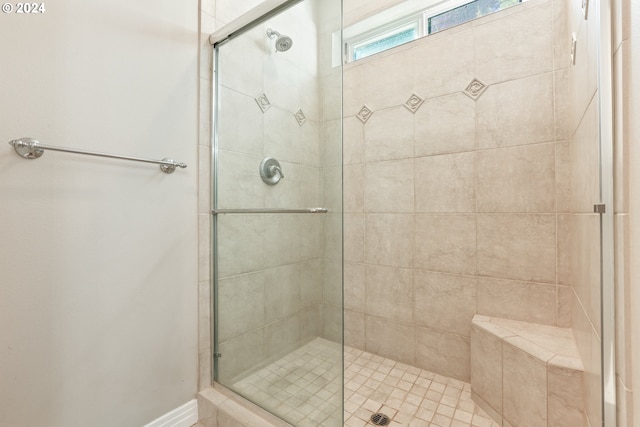 bathroom featuring an enclosed shower