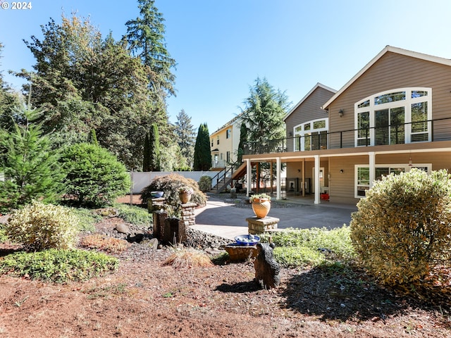 exterior space featuring a balcony and a patio