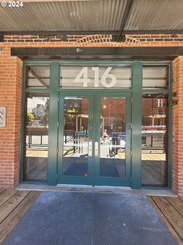 view of exterior entry featuring french doors