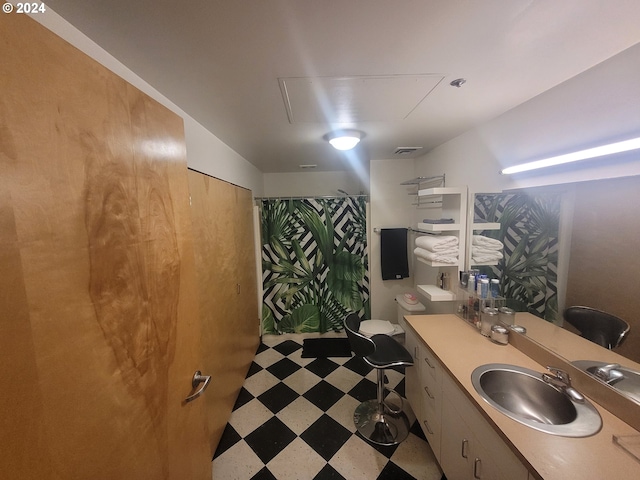 bathroom featuring vanity and curtained shower