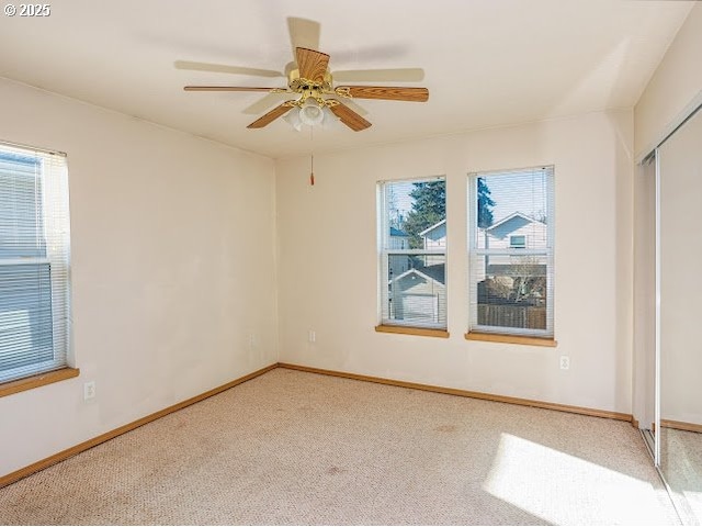 unfurnished bedroom with ceiling fan, carpet, and a closet