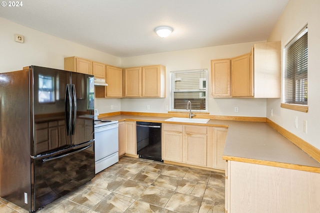 kitchen featuring black appliances, light brown cabinetry, and sink