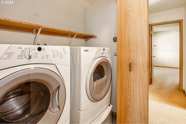 clothes washing area featuring independent washer and dryer