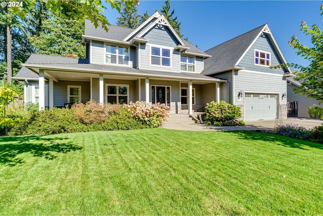 view of front facade with a front yard, concrete driveway, roof with shingles, and an attached garage