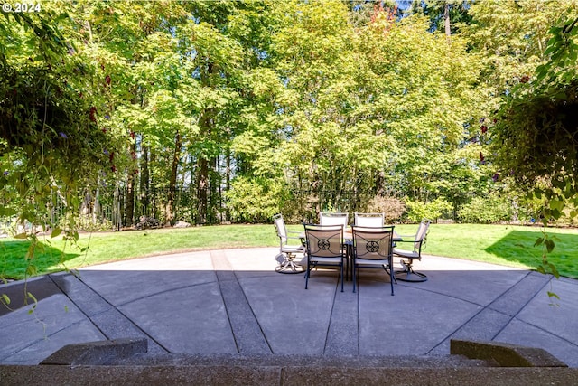 view of patio / terrace featuring outdoor dining space and fence